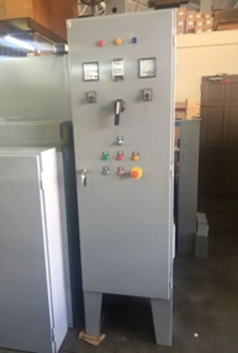 Floor-standing control cabinet with meters and emergency stop