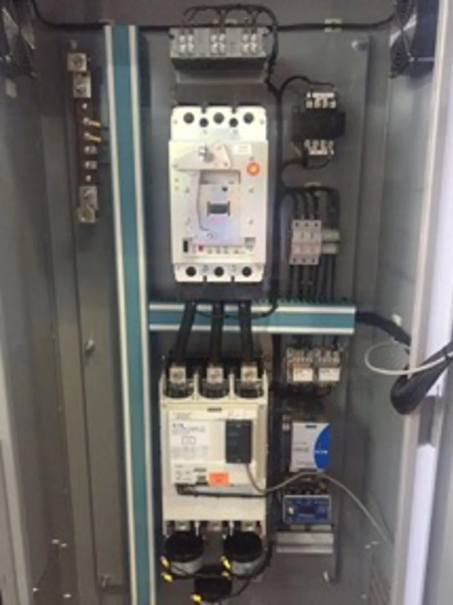 Inside an EMF panel: moulded case breakers, lugs and DIN rail