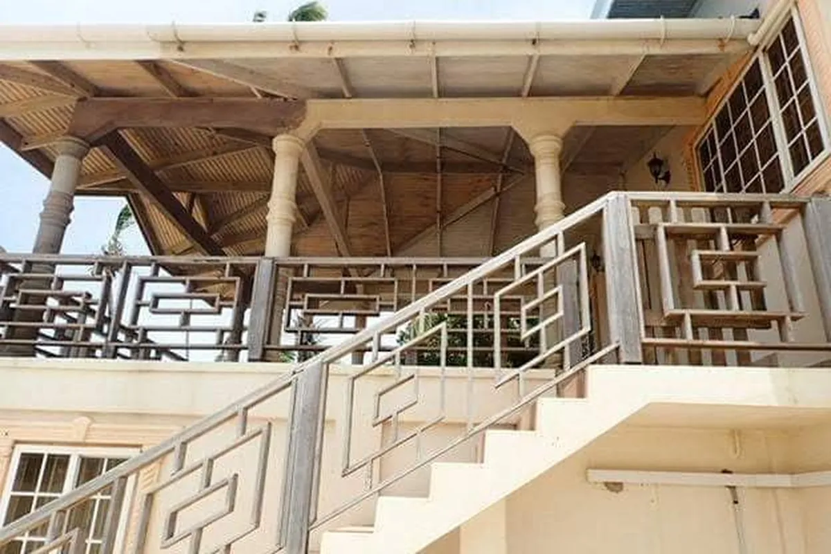Before: Weathered timber stair and balcony railings