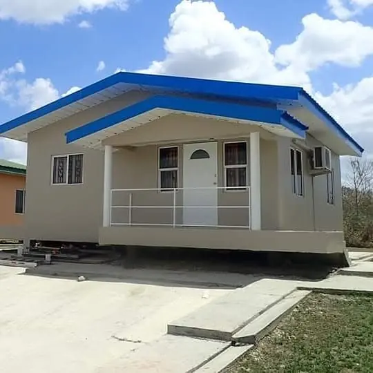 Beige house with a blue roof